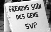 Photo avec une pancarte "Prenons soin des gens SVP"